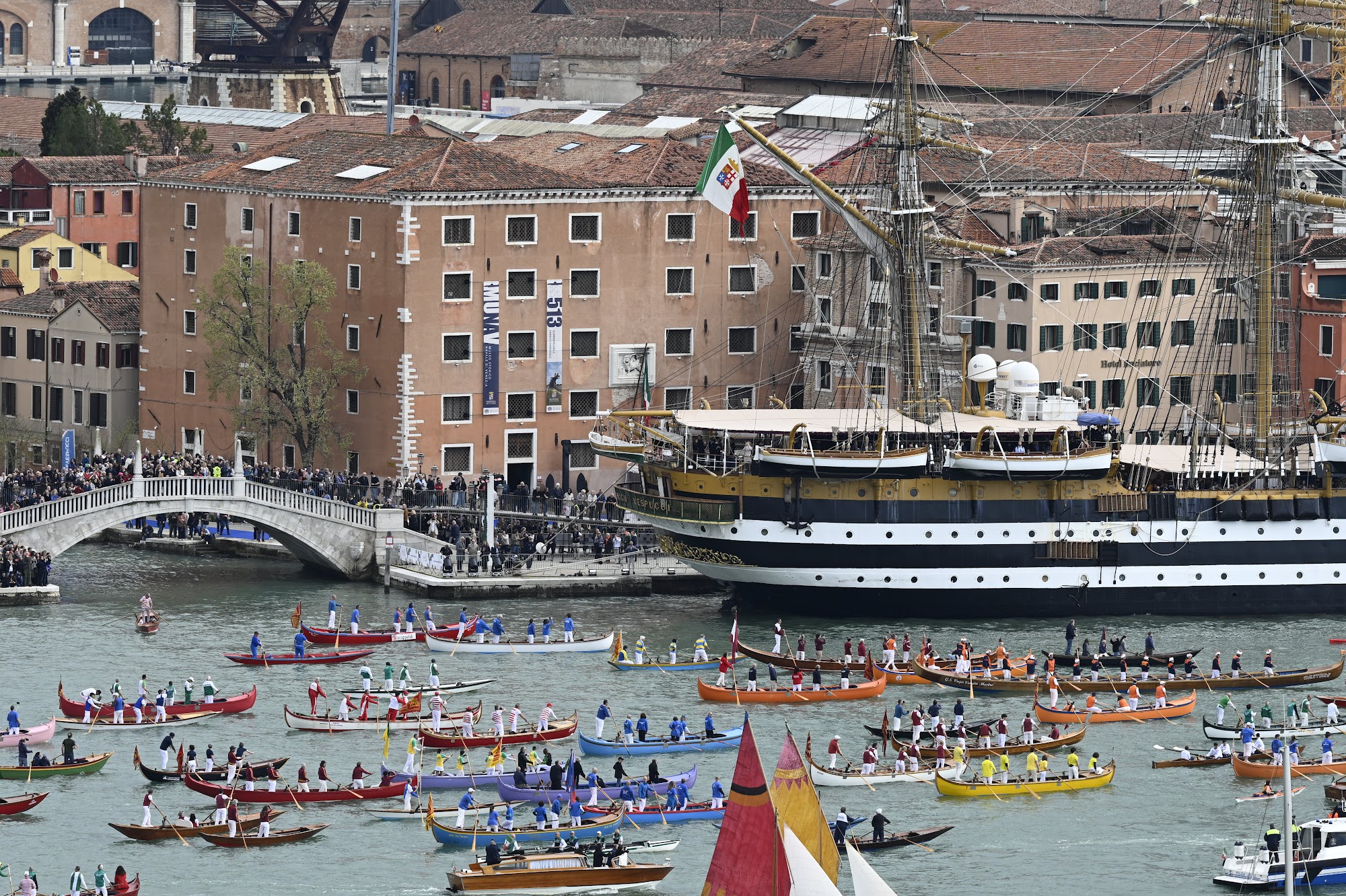 Museo Storico Navale on the Venice waterfront with a navy tall ship and a rowing regatta