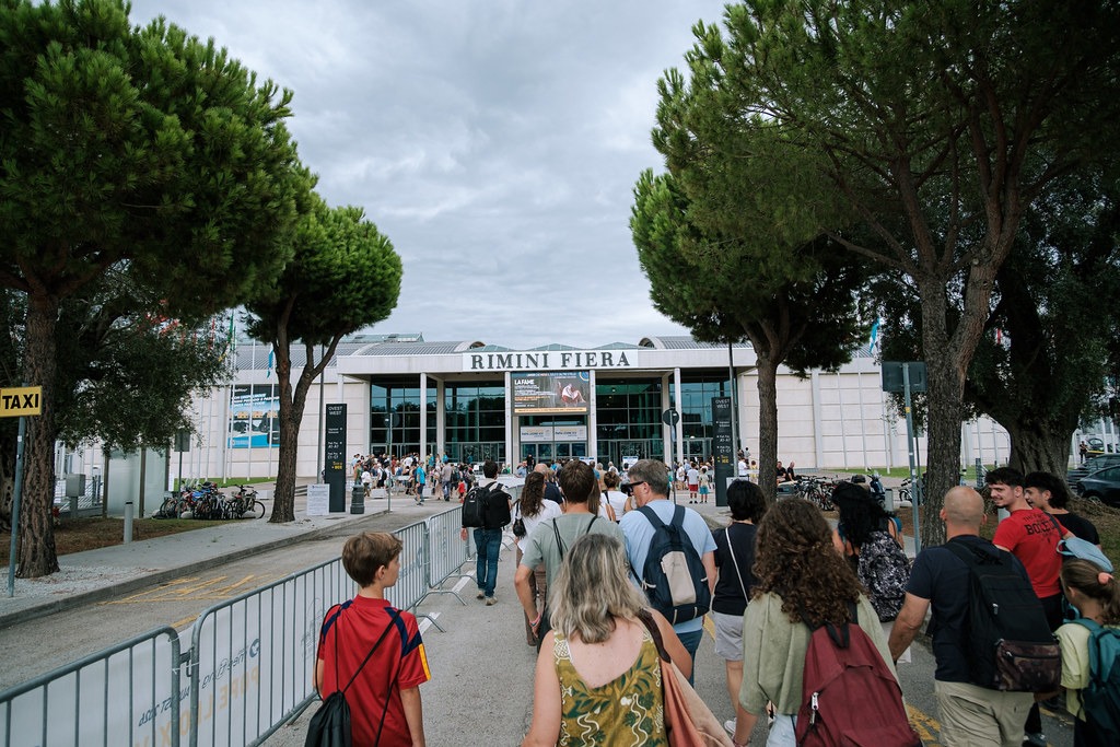 Visitors walking towards the Rimini Fiera entrance during the 2026 Meeting
